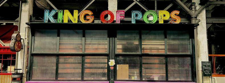 # King of Pops

Bold, colorful neon letters spell "KING OF POPS" above a black storefront in an industrial setting

#65x24
#Atlanta