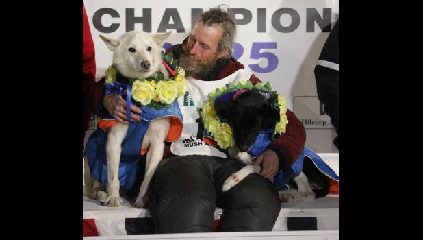 Jessie Holmes and lead dogs Polar and Hercules.
Photo by Diana Haecker, from the article