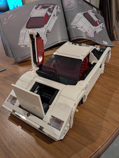 Lego lambo coming together--the trunk and a door open--it's nearly completed