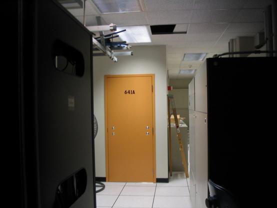 Orange door in a AT&T facility in San Francisco with room number 641A on it