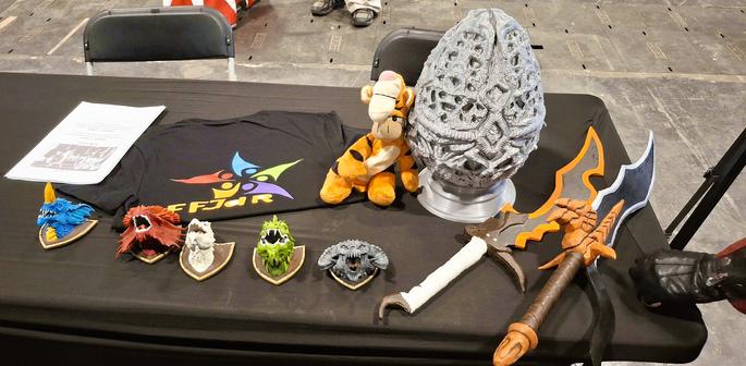 Décoration du stand : oeufs de dragons épées fantasy et mini tétes de dragons en trophée