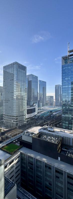 Vertical panorama photo of the view from an office building towards Tokyo Station in the Otemachi area in Tokyo, Japan.