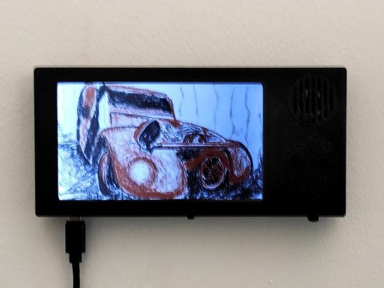 VijouScreen 5" fixed to a wall and playing on USB power.