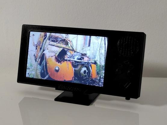 VijouScreen 5" on its stand, playing on battery power, slightly tilted for better viewing.