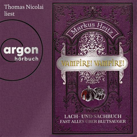 Das Cover des Sachbuch-Hörbuchs Vampire! Vampire! von Markus Heitz ist im Stil eines eines alten, geprägten Buchumschlags gehalten. Diverse Verzierungen umgeben eine Titelvignette in der zwei Knoblauchzehen abgebildet sind.