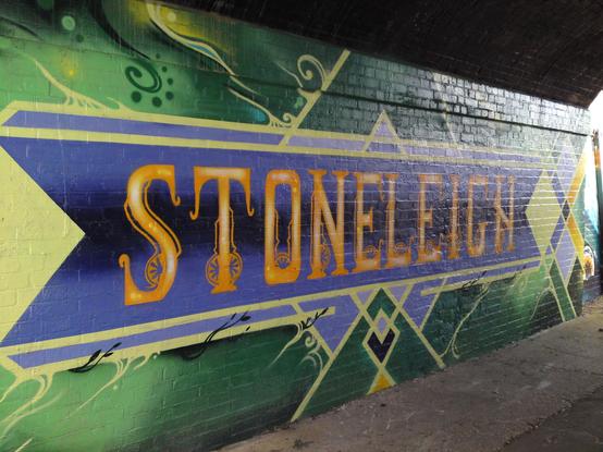 "Stoneleigh" painted in a colourful way under a bridge