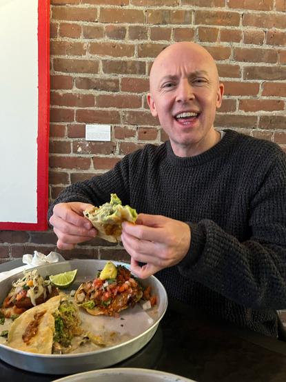 Kenny with his first Santo Taco lunch last week. a taco, a mulita, and a vampirito.
