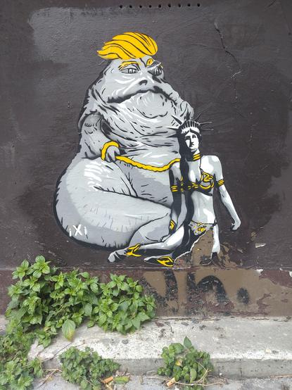 Jabba the hutt in a yellow wig, with Princess Leia on a leach, Leia where's the crown of the statue of liberty.
