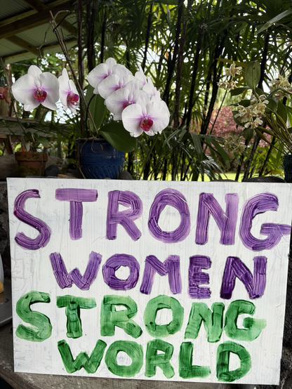 A handmade protest sign that says strong women, strong world