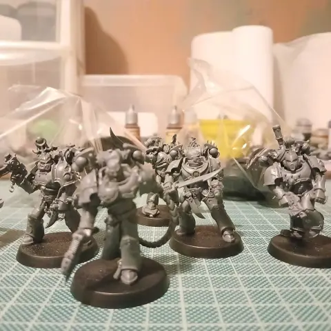 Five Infractors for Warhammer 40,000, armed with bolt pistols and falchion-like dueling sabres. The Obsessionist (squad leader, frontmost but out of focus) instead carries a rapture lash and plasma pistol, and has more accessories on his armour.