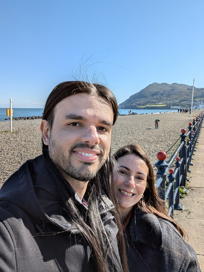 A happy couple taking a selfie in a cold but sunny day in Bray sea front.