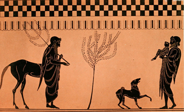 Image in terracotta and black. On the left side is the centaur Chiron, recognizable as he has the upper and lower body of a human and the hindquarters o fa horse. Across from Chron on the right is a dog and a figure holding a child.
