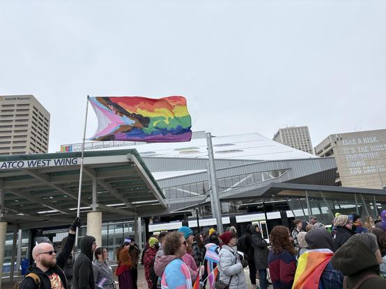 A pride flag flies in front of the Milner EPL.