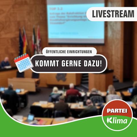 Zu sehen ist eine unscharfe Totale des Plenarsaals unseres Düsseldorfer Rathauses. In einem weißen Kasten mit abgerundeten Ecken steht in anthrazitfarbener Sprache "Öffentliche Einrichtungen". Darunter steht in einem anthrazitfarbenen Kasten mit weißen Buchstaben: „Kommt gerne dazu!"