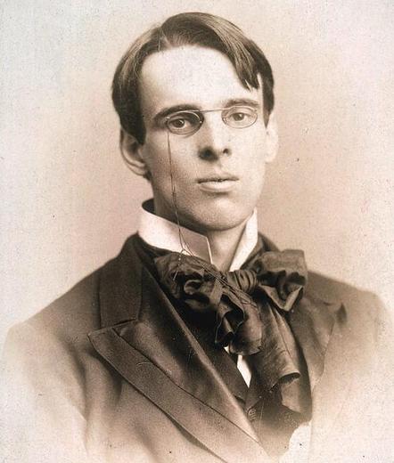 a portrait of William Butler Yeats taken around 1895, when he was 30 years old. His expression is both intense and slightly resigned