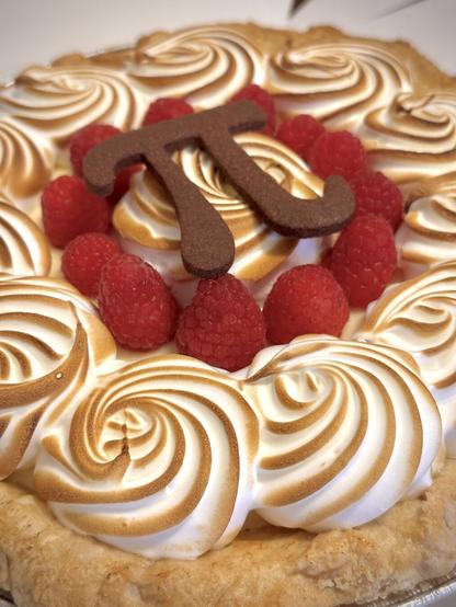 Raspberry Lemon Meringue ‘Pi Day’ pie from The Duchess Bake Shop in Edmonton AB. Features a cookie π symbol cut out.