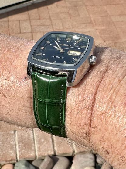 green wristwatch selfie