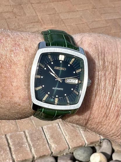 green wristwatch selfie