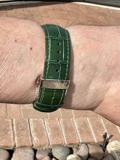 green wristwatch selfie