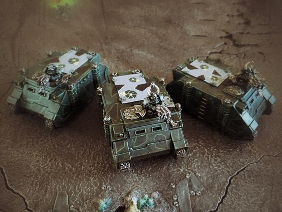 Three rhino transports with custom tranfers on top.