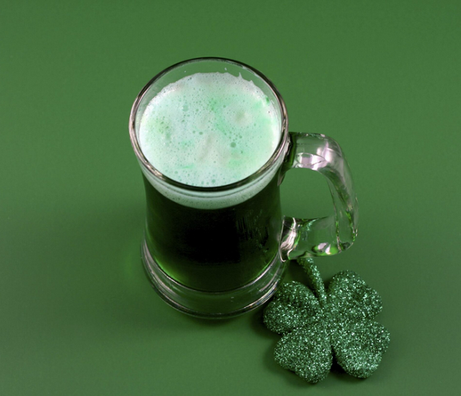Color image of a mug full of green beer.