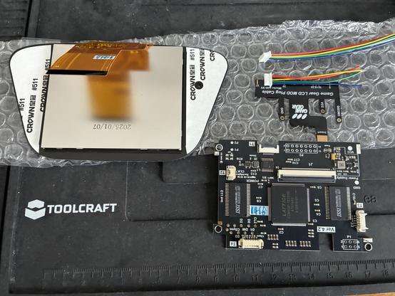A laminated LCD acreen with FPGS board and cables.