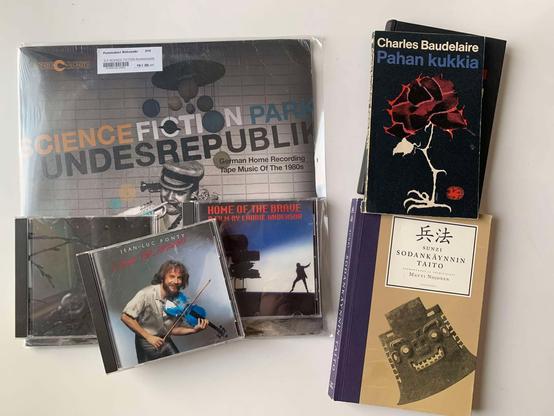 Flea market finds: CDs, books and one LP.