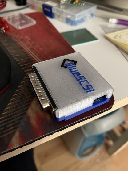 External BlueSCSI module sitting on a mousepad