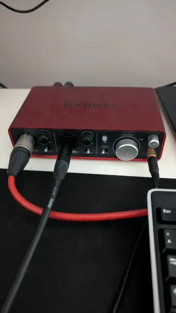 focusrite 2i2 1st gen audio interface with some cables plugged in