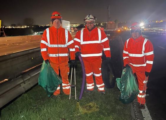 Workers collecting rubbish during the A38 closure