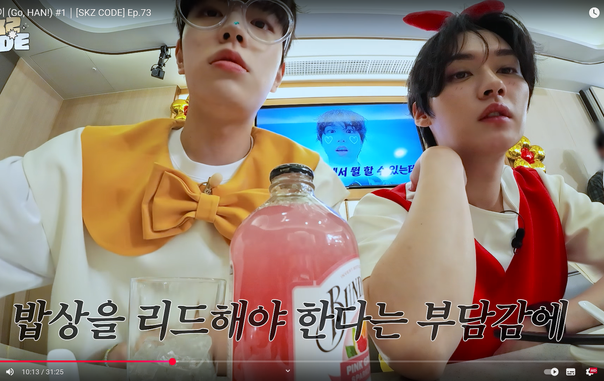 Product placement shot?? Bundaberg pink grapefruit bottle on the table between Seungmin and Lee Know