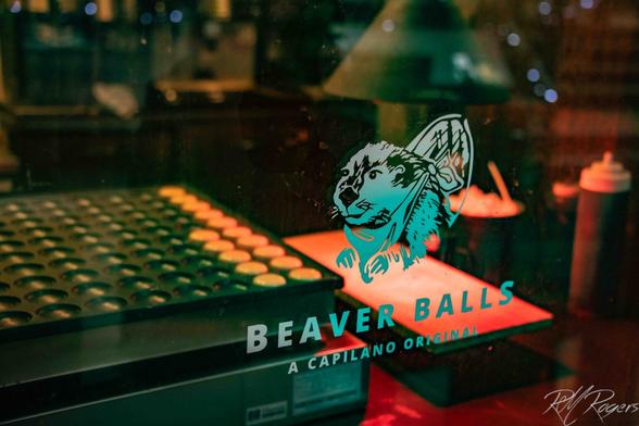 A photograph of a store front advertising “Beaver Balls,” a type of cookie/pastry sold in Vancouver, BC.