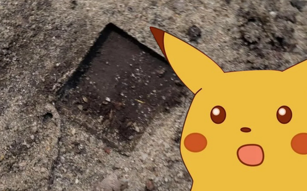 Shocked Pikachu next to impression in dirt where 3DS cartridge was found