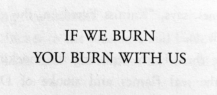 Pictured is a quote from the novel Mockingjay: “If we burn you burn with us.”