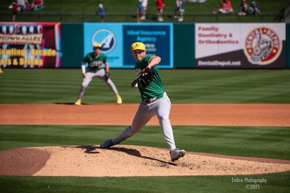 Athletics star closing pitcher, Mason Miller, winds up and throws an epic fastball to the plate during a March 2025 Cactus League game.