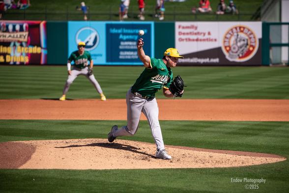 Athletics star closing pitcher, Mason Miller, winds up and releases the ball towards the plate during a March 2025 Cactus League game.