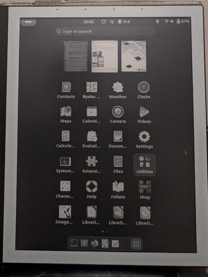 The PineNote showing the app launcher with a grid of apps with large icons and legible text. The dock ble is much smaller icons.
