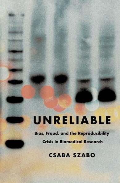 The book cover: grey background with black, orange, yellow parts that look kind of like biomedicine stuff. I've got no idea what this actually is! I'm not a biomedicine person.