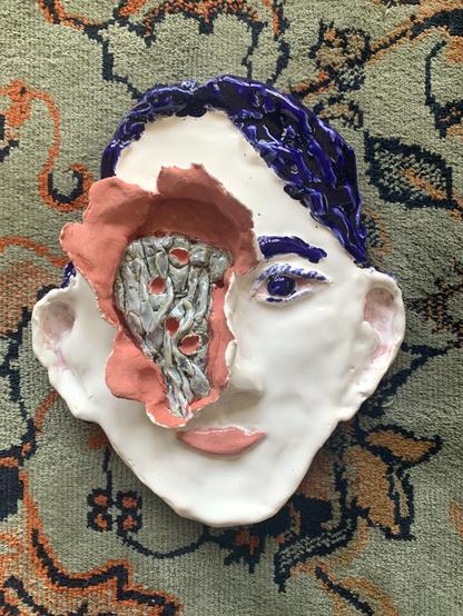 Cermics work (face party torn open to reveal the inside)