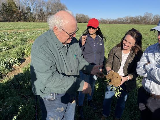 A regen ag cotton grower showing us the impacts of cover crops on soil texture and biodiversity.