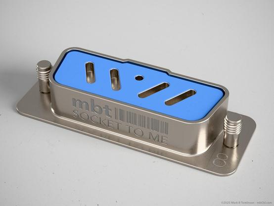 Small RS-232 type socket with 4 slotted sockets and inverted o pin in the centre.
"Socket to me" inscribed on the front.