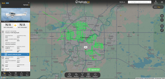 A screenshot of live flight-tracking website Flightradar24, showing a map of Edmonton. A couple of planes are visible, a small one - a Cessna 172N Skyhawk with few other details - is selected. It shows it flying around 4800ft with a flight path that took off from Villeneuve (a small airport northwest of the city), and then making multiple passes over about 6 areas of the city, forming hash patterns over those areas.