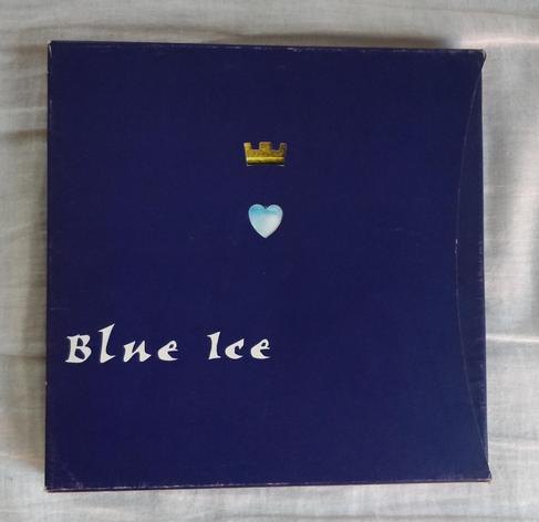 The box cover of Blue Ice depicting a heart and a crown on a dark blue background.