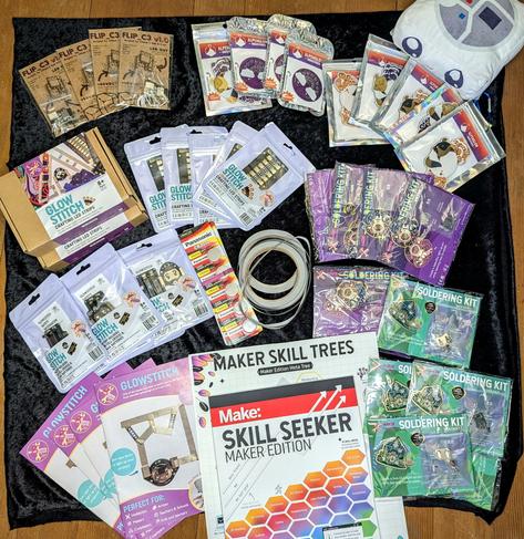 A large organized pile of soldering kits from the makers mentioned in the post. They are all neatly packaged, aesthetic, and fun looking.