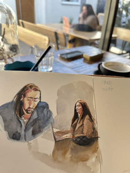 Sketch of a lady working from coffee shop; and a window view from my perspective