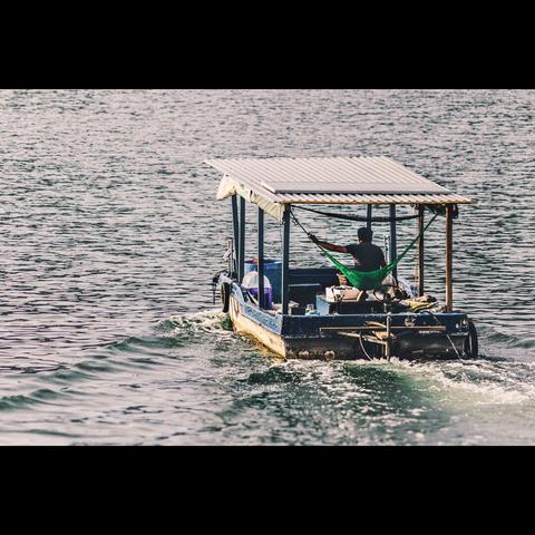 Photo in color of a fisherman boat in Halong bay, Vietnam