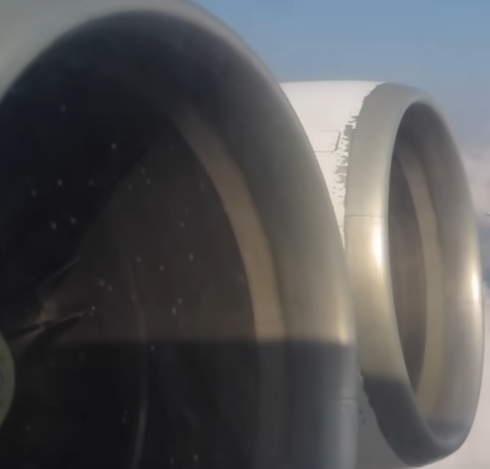 The left-side inner engine of an IL-62M seemingly not spinning at all whilst at cruise altitude
