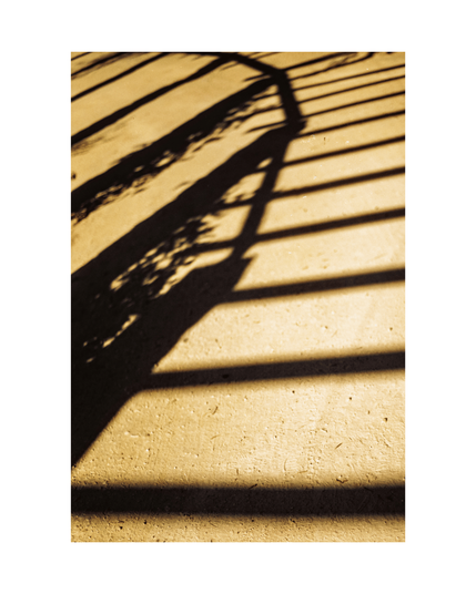 concrete floor in beige color with mesmerizing linear shadow abstractions