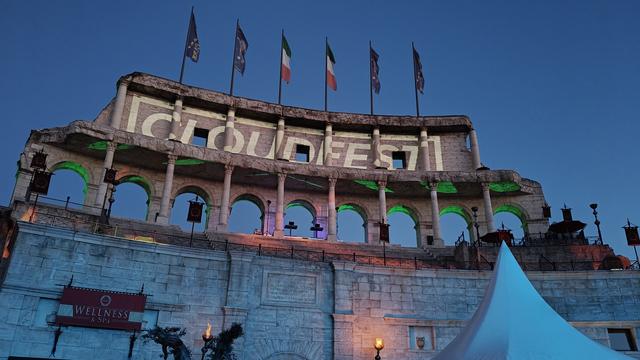 A fake part of the Colosseum in Rome with the CloudFest logo projected on it.