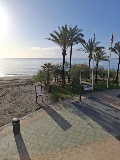 Foto from the beach with calm waves and a blue sky